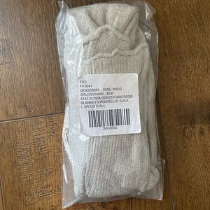 Brand NEW Free People knee high socks. Gray fuzzy material. Never worn.